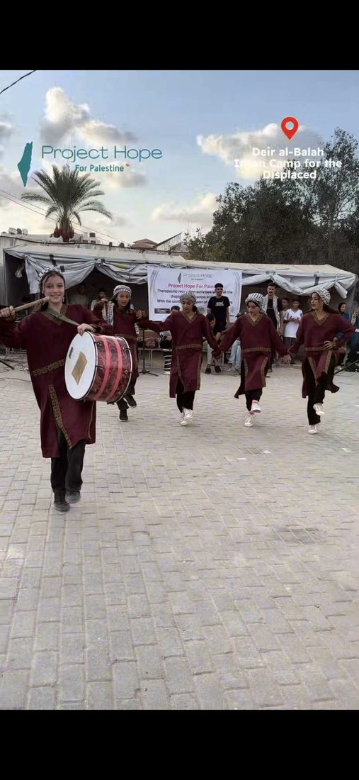 A dabke troupe performing at a displacement camp
