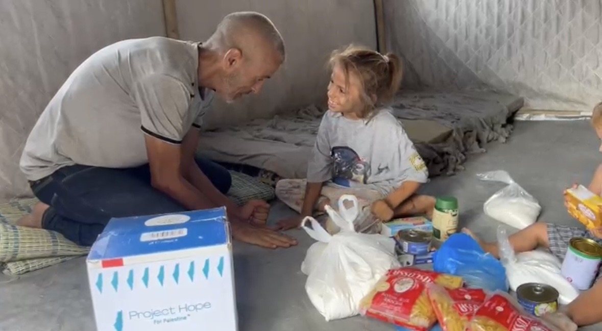 An aid parcel delivered to a family with a young child.