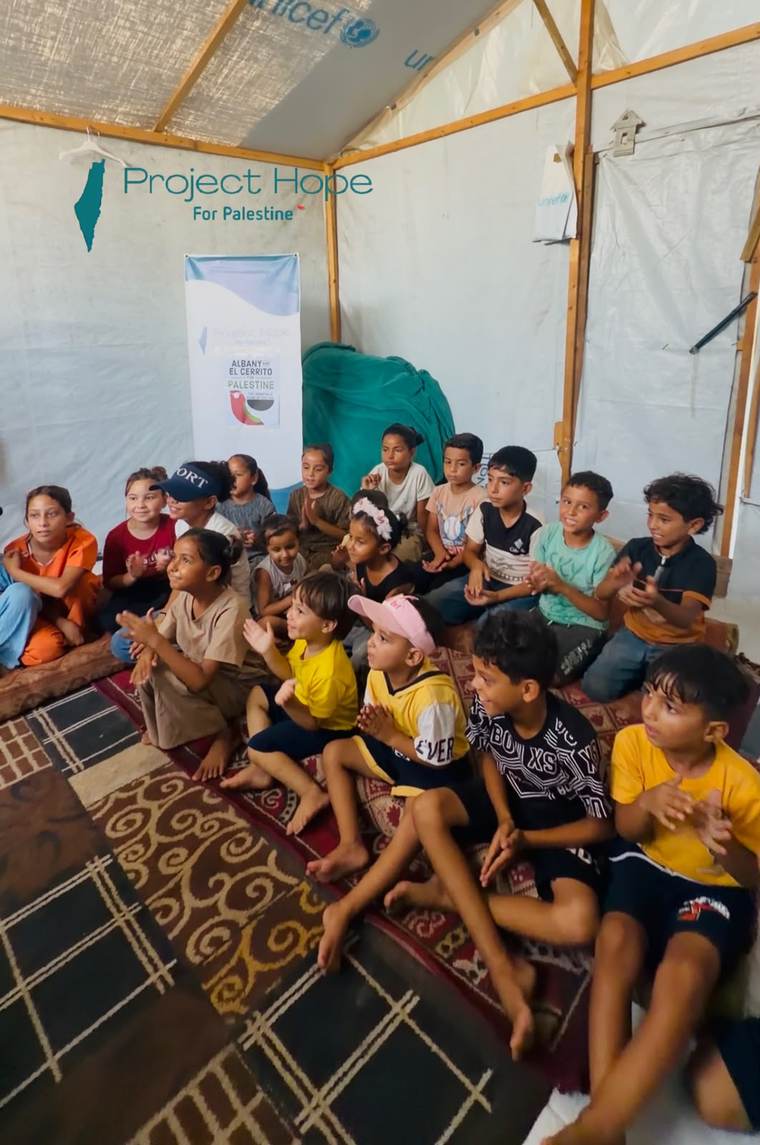 Children in a Project Hope activity tent in a displacement camp